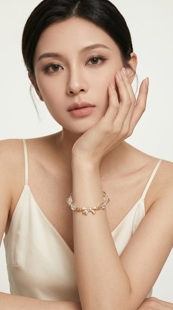 Clear quartz bracelet on wrist · women's hand-shot, Origin series